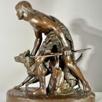 Alt text: Bronze sculpture of a figure with a dog