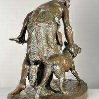 Alt text: Bronze sculpture of a figure with a dog