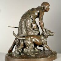 Alt text: Bronze sculpture of a figure with a dog