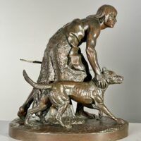 Alt text: Bronze sculpture of a figure with a dog