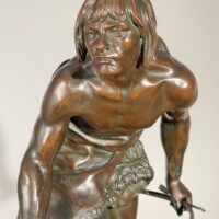 Alt text: Bronze sculpture of a figure with a dog