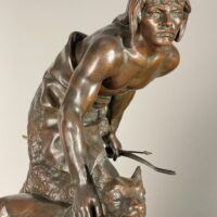 Alt text: Bronze sculpture of a figure with a dog