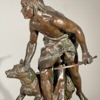 Alt text: Bronze sculpture of a figure with a dog