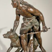 Alt text: Bronze sculpture of a figure with a dog