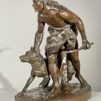 Alt text: Bronze sculpture of a figure with a dog