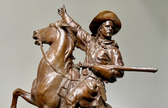 Alt text: Bronze sculpture of a man on a horse