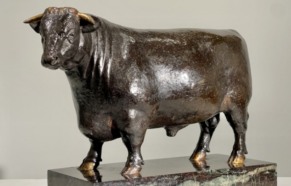 Alt text: Bronze sculpture of a bull