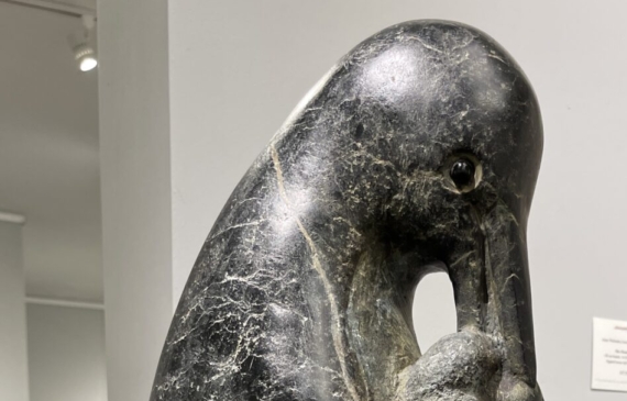 Alt text: Stone sculpture of a penguin