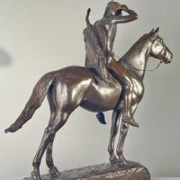 Alt text: Bronze sculpture of a man on horseback