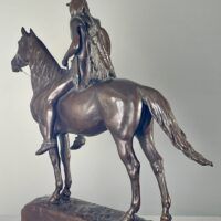 Alt text: Bronze sculpture of a man on horseback