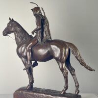 Alt text: Bronze sculpture of a man on horseback