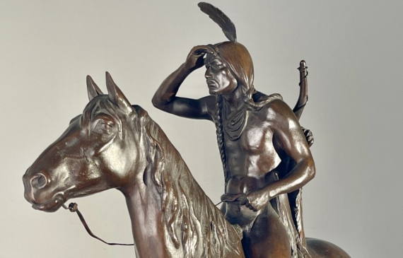 Alt text: Bronze sculpture of a man on horseback