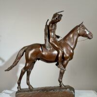 Alt text: Bronze sculpture of a man on horseback