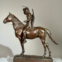 Alt text: Bronze sculpture of a man on horseback