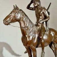 Alt text: Bronze sculpture of a man on horseback