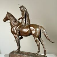 Alt text: Bronze sculpture of a man on horseback