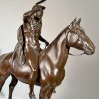 Alt text: Bronze sculpture of a man on horseback
