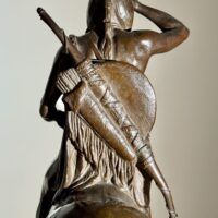 Alt text: Bronze sculpture of a man on horseback