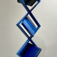 Alt text: Blue geometric sculpture