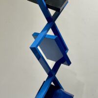 Alt text: Blue geometric sculpture