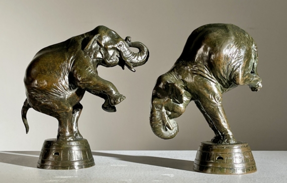 Alt text: A pair of bronze sculptures depicting circus elephants