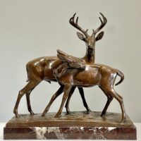 Alt text: Bronze sculpture of two deer