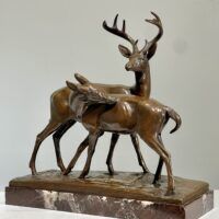 Alt text: Bronze sculpture of two deer