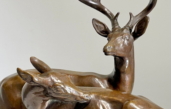 Alt text: Bronze sculpture of two deer