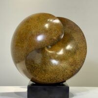 Alt text: Spherical bronze sculpture