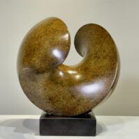 Alt text: Spherical bronze sculpture