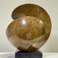 Alt text: Spherical bronze sculpture