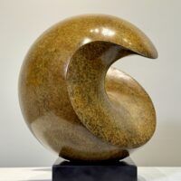 Alt text: Spherical bronze sculpture