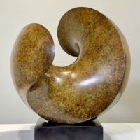 Alt text: Spherical bronze sculpture