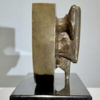 Alt text: Abstract bronze sculpture