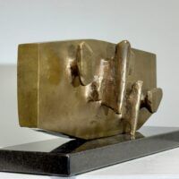 Alt text: Abstract bronze sculpture