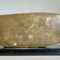 Alt text: Abstract bronze sculpture