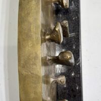 Alt text: Abstract bronze sculpture