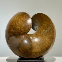Alt text: Spherical bronze sculpture