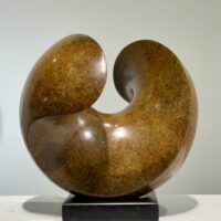 Alt text: Spherical bronze sculpture