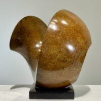 Alt text: Spherical bronze sculpture
