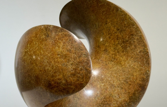 Alt text: Spherical bronze sculpture