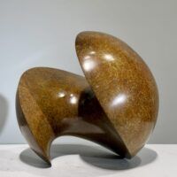 Alt text: Spherical bronze sculpture