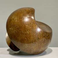 Alt text: Spherical bronze sculpture