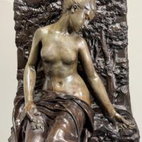 Alt text: Bronze sculpture of a woman