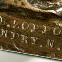 Alt text: Bronze sculpture, foundry detail