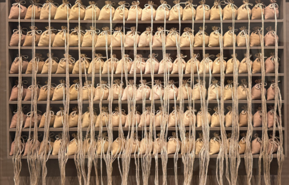 Alt text: A box construction made of rows of bags on shelves