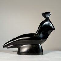 Alt text: Abstracted sculpture of a reclining nude figure