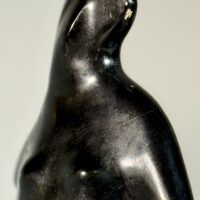 Alt text: Abstracted sculpture of a figure, detail