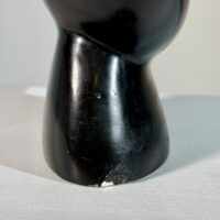 Alt text: Sculpture base detail