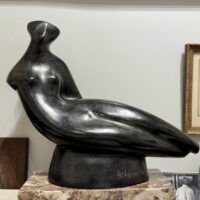 Alt text: Abstracted sculpture of a reclining nude figure